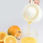 A premium manual juicer squeeze machine for Kinnow, orange, and lemon, featuring a hand press design for efficient citrus juice extraction