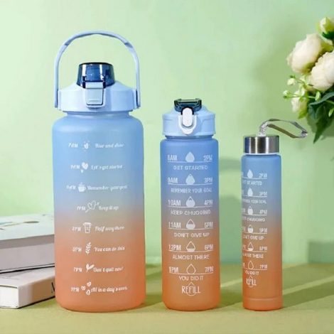 Set of 3 gradient water bottles in various sizes (1 gallon, 32oz, 18oz) with motivational time markers, leakproof design, and ergonomic handles in vibrant colors.