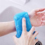 Colorful silicone back scrubbers with handles, featuring a dual-sided design for exfoliating and massaging, ideal for deep cleansing in the shower